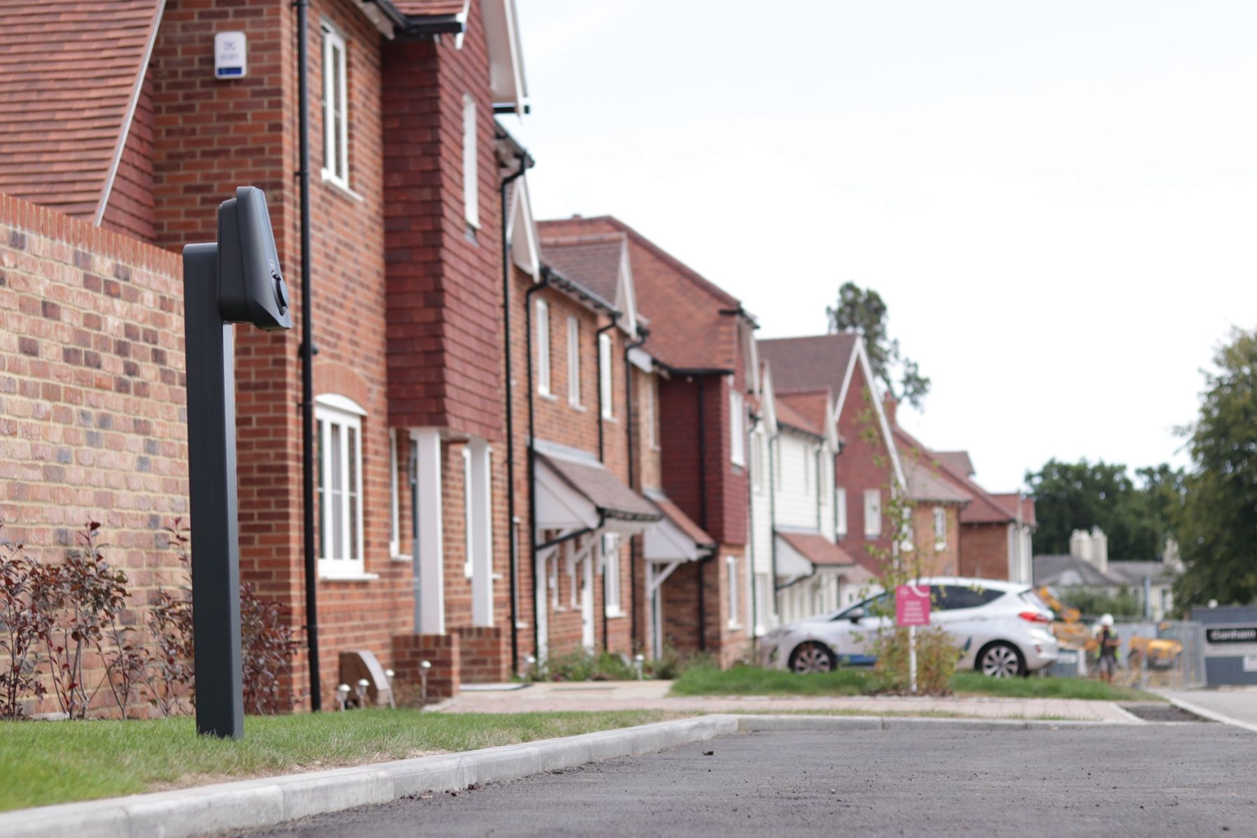 A street of new homes with post-mounted Brim chargers by each drive