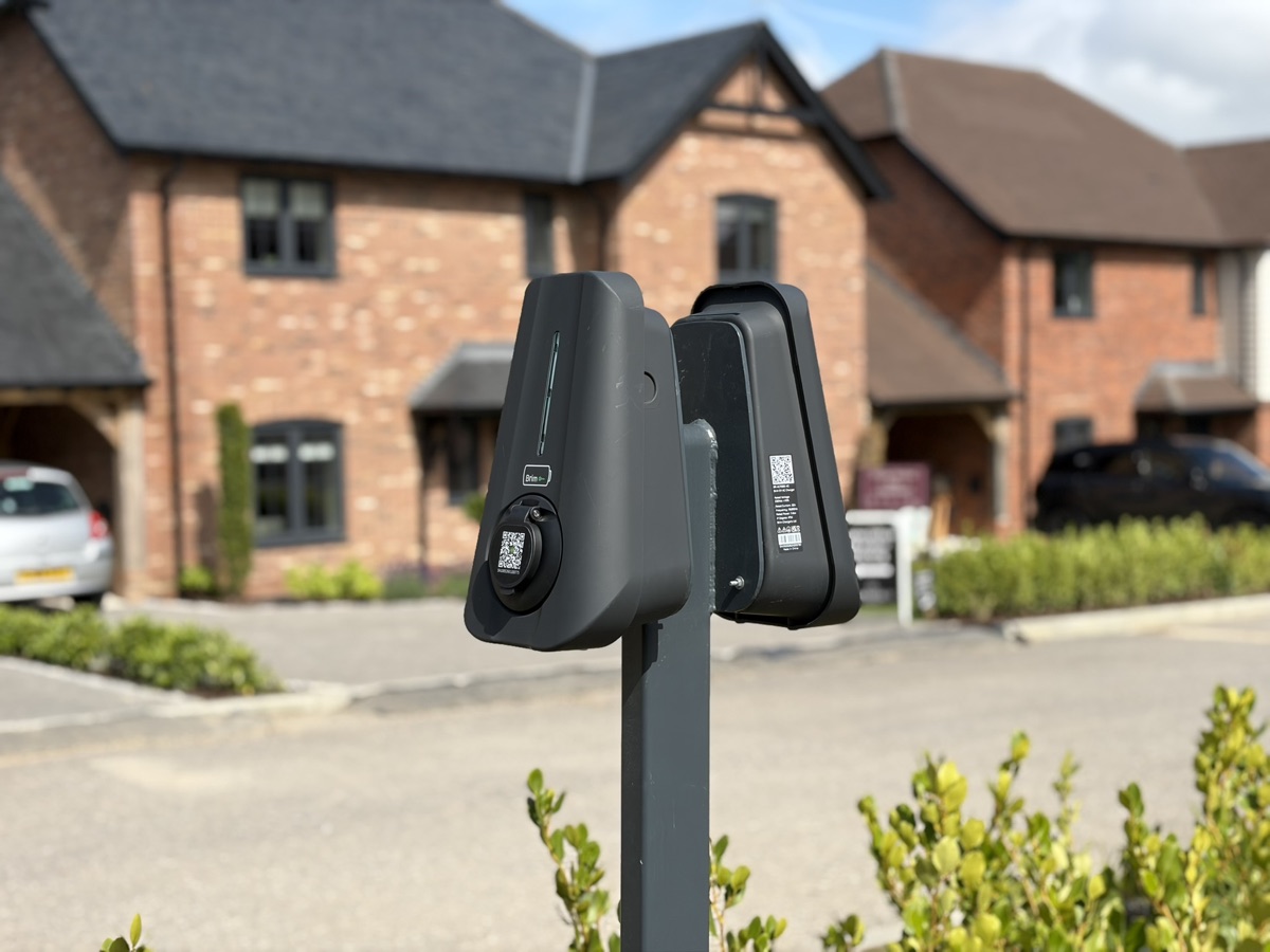 Two Brim chargers on a shared post at a new-build development