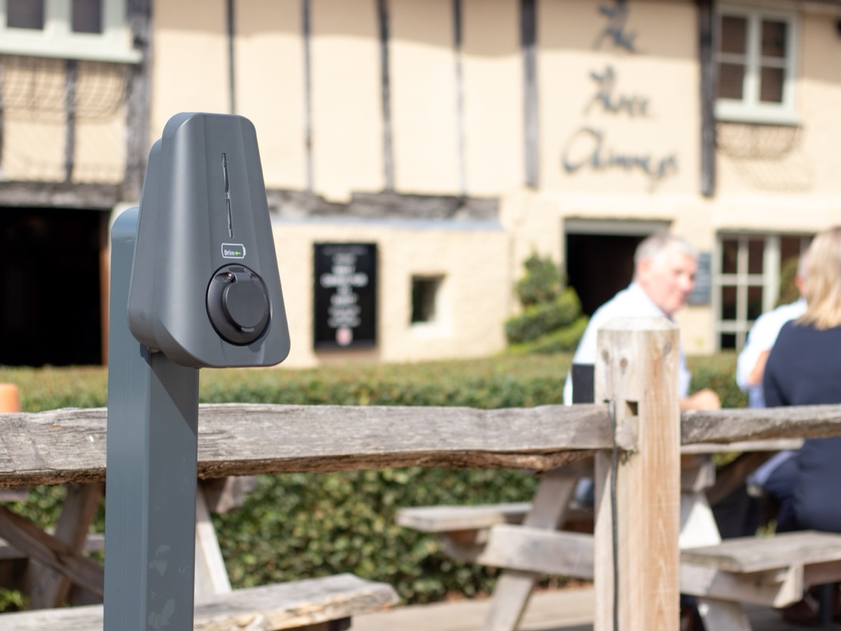 A Brim charger standing on its post outside an established building